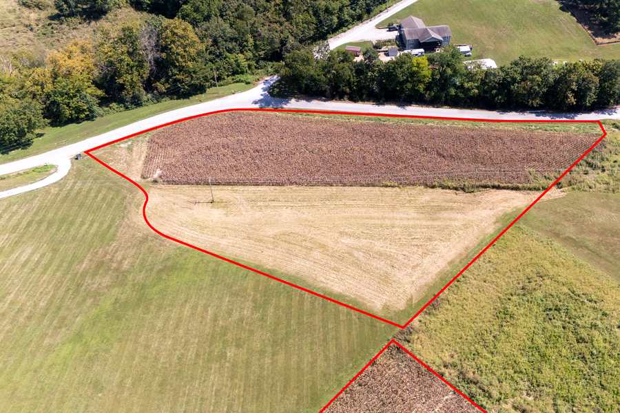 Aerial view of a cleared field along the road frontage of the Berryville Road acreage in Union County, IL, outlined in red